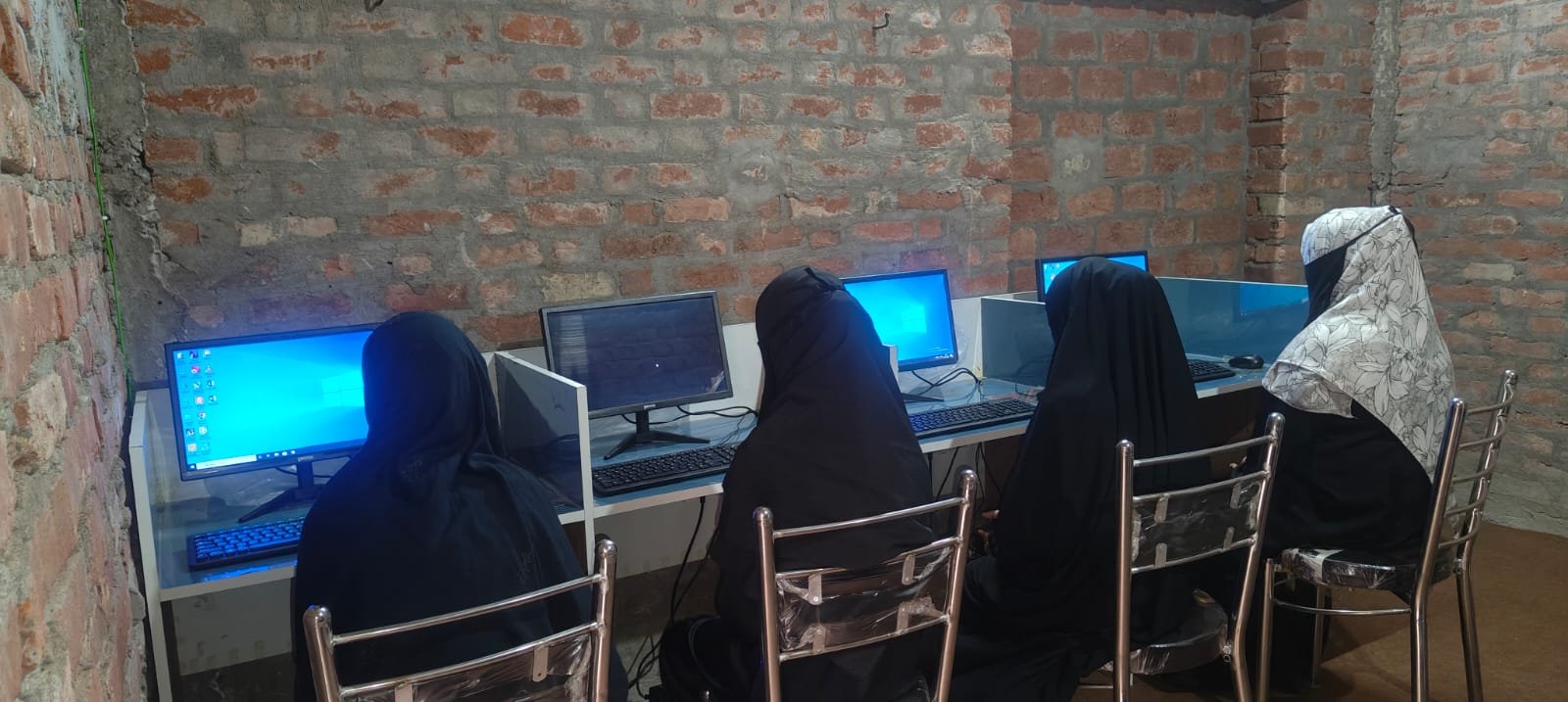 Girls attending a learning session at Darul Zahra